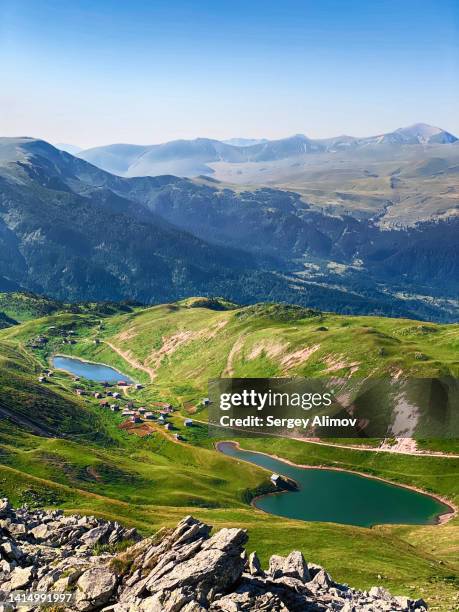 small village between mountain lakes among green summer hills and rocks, shuamta, tetrobi mountain, georgia - georgia country stock pictures, royalty-free photos & images