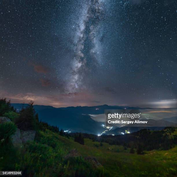 milky way above night mountain landscape - georgian stock pictures, royalty-free photos & images