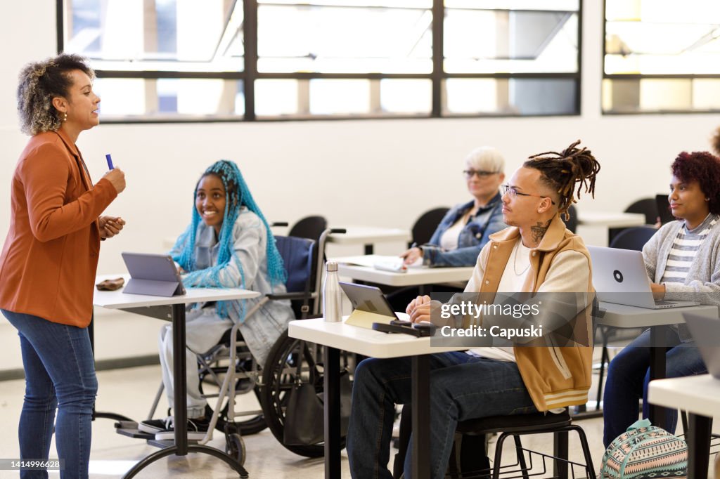 Curly haired professor teaching class