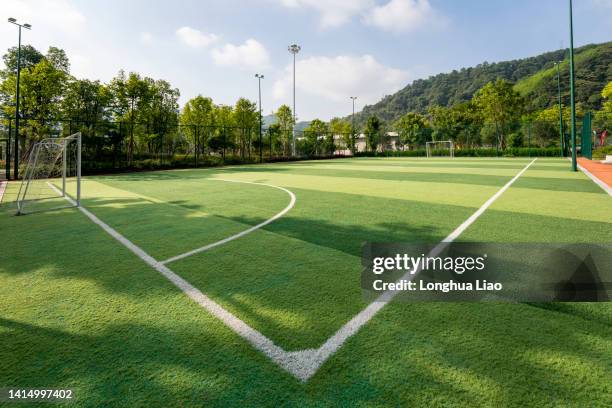 a football field with artificial turf - turf fotografías e imágenes de stock