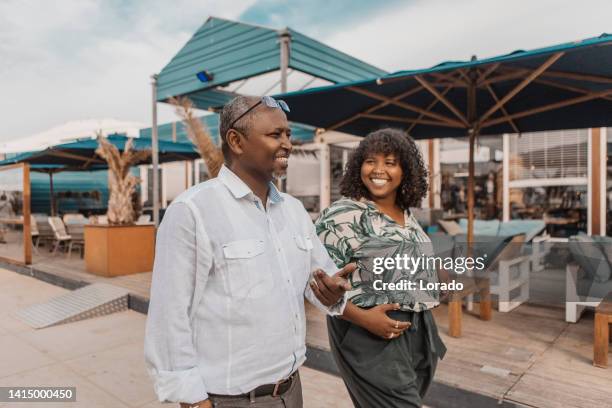 portrait of active handsome senior african man and daughter - east african people stock pictures, royalty-free photos & images