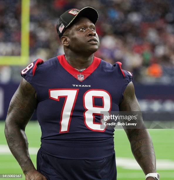 Laremy Tunsil of the Houston Texans stands on the sidelines against the New Orleans Saints in a preseason game at NRG Stadium on August 13, 2022 in...