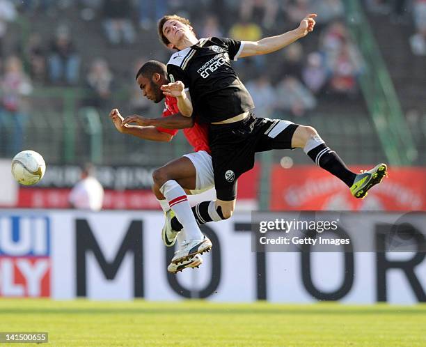 Phil Ofosu-Ayeh of Erfurt and Marcel Kandziora of Sandhausen battle for the ball during the Third League match at Steigerwald Stadium on March 17,...