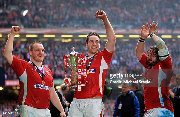 Gethin Jenkins, Ryan Jones and Adam Jones celebrate their team's Grand Slam victory with the Six Nations trophy during the RBS Six Nations...