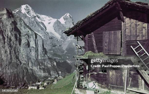 View of the peaks of the Eiger and Monch mountains from the village of Murren in the Bernese Highlands of Switzerland circa 1965.