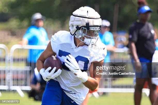 Phillip Lindsay of the Indianapolis Colts runs a drill during training camp at Grand Park Sports Campus on August 11, 2022 in Westfield, Indiana.
