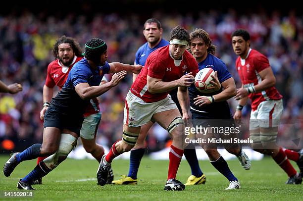Ryan Jones of Wales is tackled by Thierry Dusautoir of France during the RBS Six Nations Championship match between Wales and France at the...