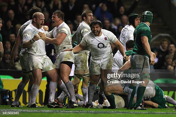 England's front row forwards, Dan Cole, Dylan Hartley and Alex Corbisiero celebrate after forcing Ireland to concede a penalty try during the RBS Six...