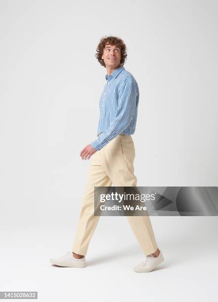 young man looking over his shoulder - portrait side view stock pictures, royalty-free photos & images