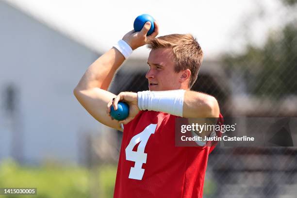 Sam Ehlinger of the Indianapolis Colts warms up during training camp at Grand Park Sports Campus on August 11, 2022 in Westfield, Indiana.