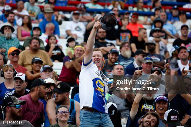Race fan cheers during the NASCAR Cup Series Federated Auto Parts 400 at Richmond Raceway on August 14, 2022 in Richmond, Virginia.