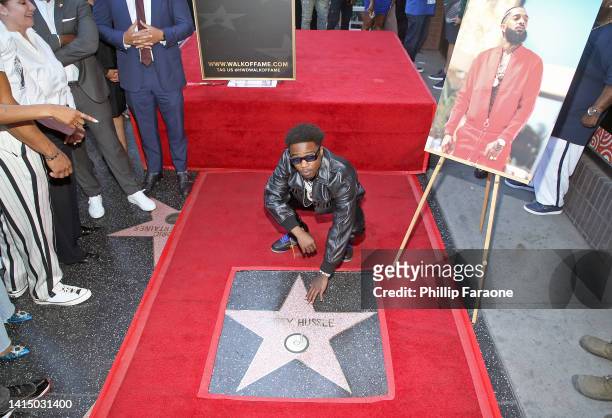 Roddy Ricch is seen as Nipsey Hussle is posthumously honored with a star on The Hollywood Walk of Fame on August 15, 2022 in Los Angeles, California.