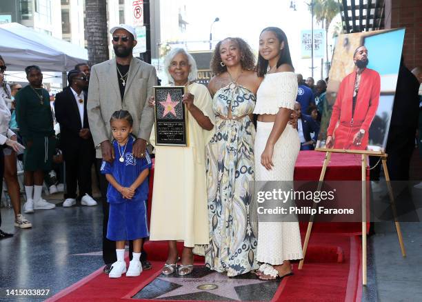 Dawit Asghedom, Kross Ermias Asghedom, Margaret Boutte, Samantha Smith, and Emani Asghedom are seen as Nipsey Hussle is posthumously honored with a...