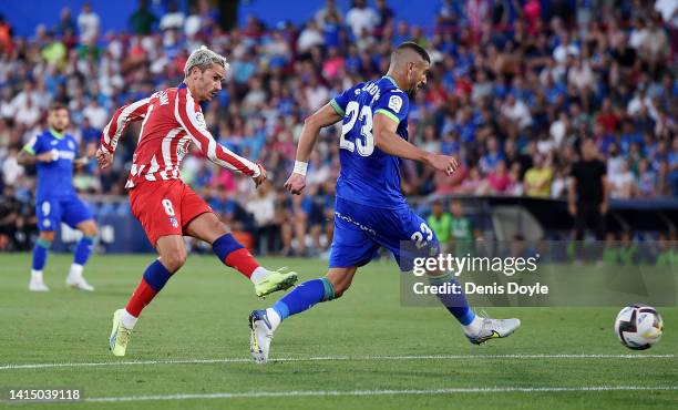 Antoine Griezmann of Atlético Madrid scores their team's first goal during the LaLiga Santander match between Getafe CF and Atletico de Madrid at...