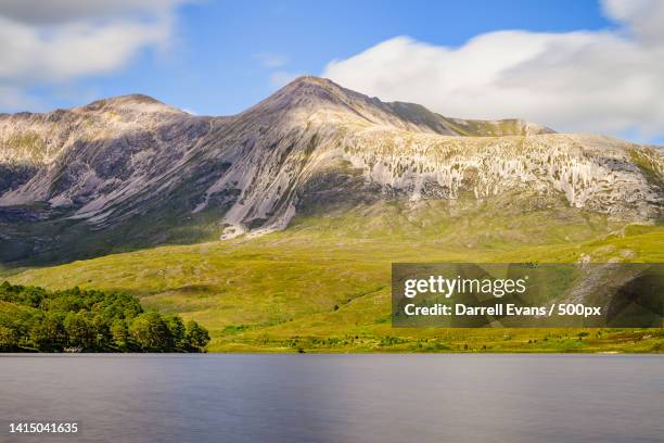 scenic view of lake by mountains against sky,torridon,achnasheen,united kingdom,uk - a ross stock pictures, royalty-free photos & images