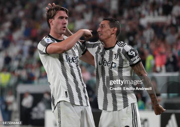 Dusan Vlahovic of Juventus celebrates his second goal with his team-mate Angel Di Maria during the Serie A match between Juventus and US Sassuolo at...