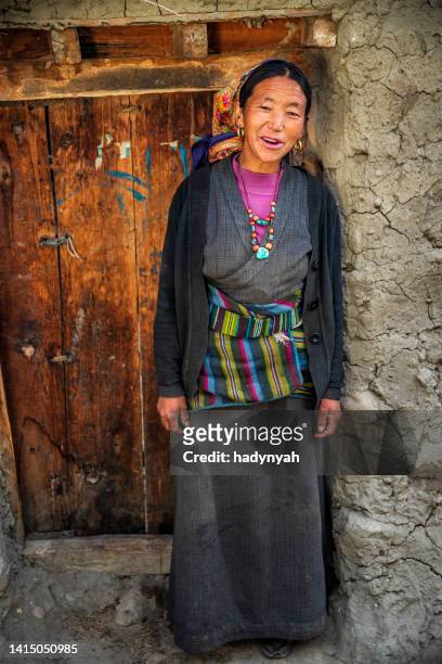 portrait of happy tibetan woman, upper mustang, nepal - nepal women stock pictures, royalty-free photos & images
