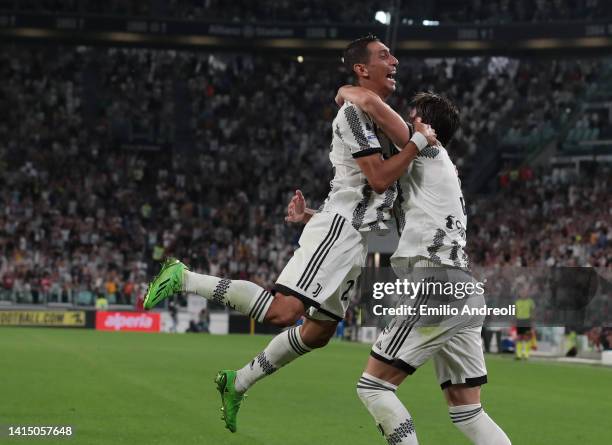 Dusan Vlahovic of Juventus celebrates his second goal with his team-mate Angel Di Maria during the Serie A match between Juventus and US Sassuolo at...