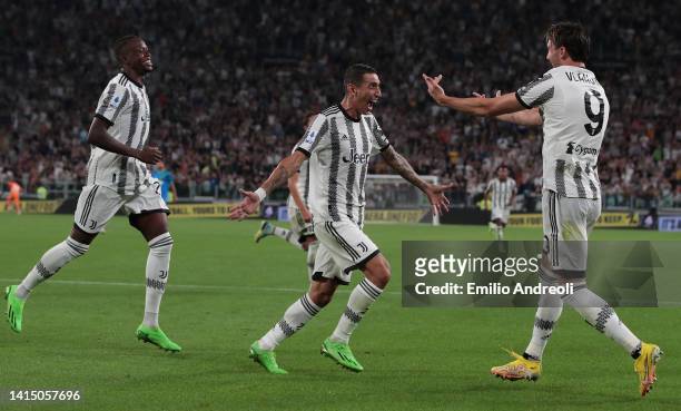 Dusan Vlahovic of Juventus celebrates his second goal with his team-mate Angel Di Maria and Denis Zakaria during the Serie A match between Juventus...