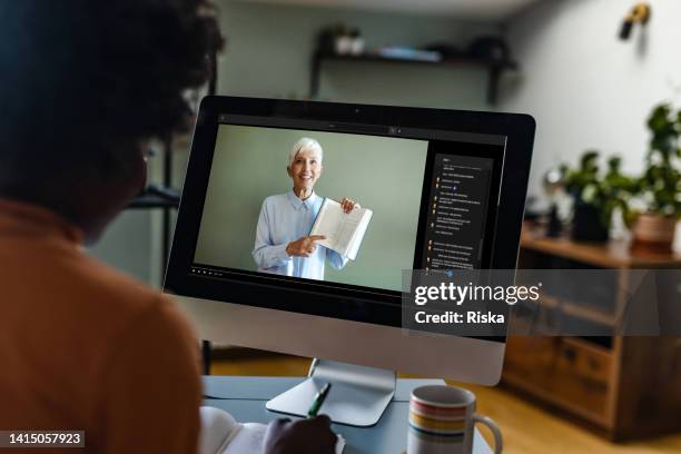young woman watching online class with teacher - tutorial stock pictures, royalty-free photos & images