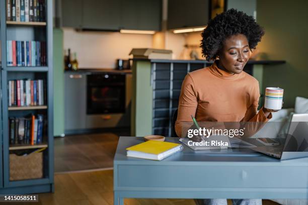 young woman being productive at home - examination room bildbanksfoton och bilder