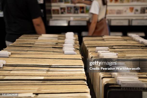 old folders of postcard archives in postcard store. - sala de arquivos imagens e fotografias de stock