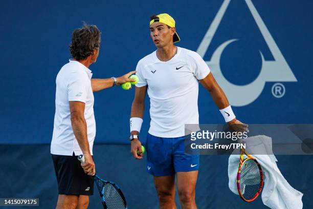 Rafael Nadal of Spain practices with his coach, Francisco Roig Genís in advance of his first match at the Lindner Family Tennis Center on August 15,...