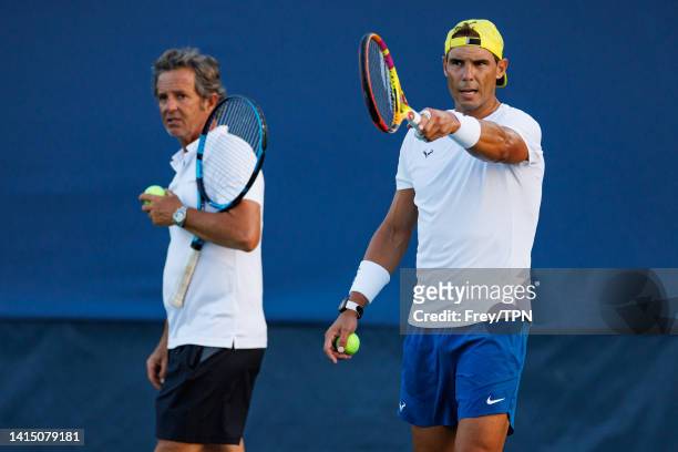 Rafael Nadal of Spain practices with his coach, Francisco Roig Genís in advance of his first match at the Lindner Family Tennis Center on August 15,...