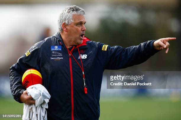 Demons assistant coach Mark Williams directs players during a Melbourne Demons AFL training session at Casey Fields on August 16, 2022 in Melbourne,...