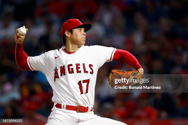 Shohei Ohtani of the Los Angeles Angels throws against the Seattle Mariners in the fourth inning at Angel Stadium of Anaheim on August 15, 2022 in...