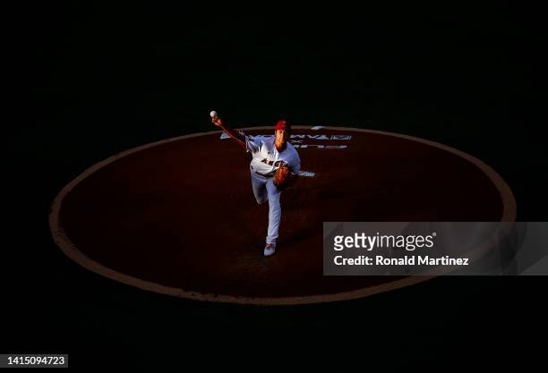 Shohei Ohtani of the Los Angeles Angels throws against the Seattle Mariners in the first inning at Angel Stadium of Anaheim on August 15, 2022 in...