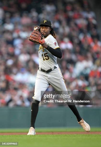 Oneil Cruz of the Pittsburgh Pirates throws to first base off balance throwing out Austin Wynns of the San Francisco Giants in the bottom of the...