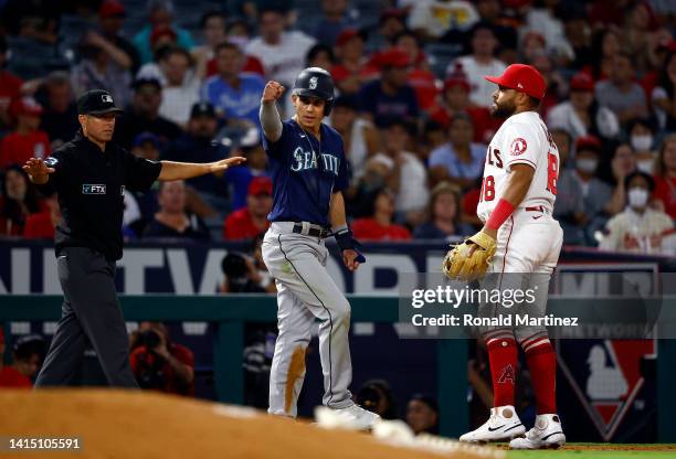 Sam Haggerty of the Seattle Mariners after stealing third base against the Los Angeles Angelsin the ninth inning at Angel Stadium of Anaheim on...