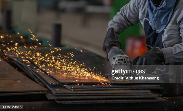 technician cutting for steel structure at manufacture workshop. - circular saw stockfoto's en -beelden
