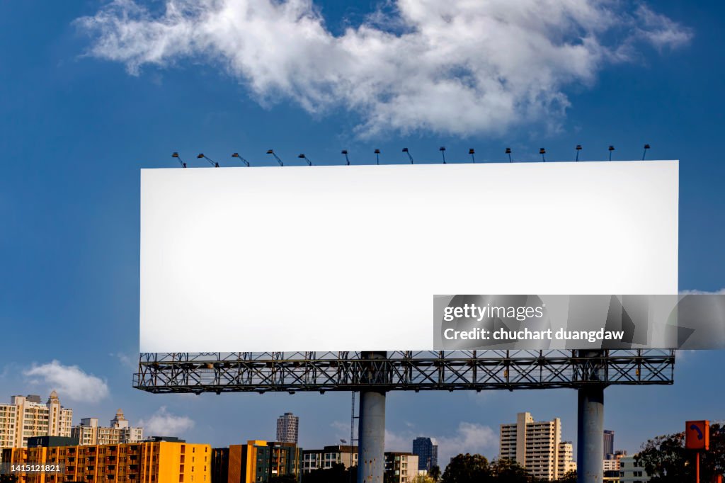 Billboard blank advertising banner media display and sky background