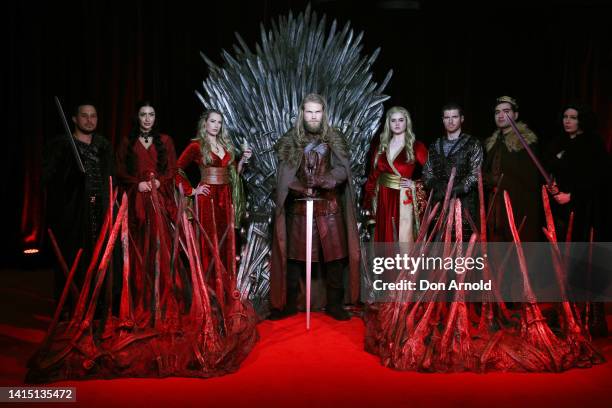 Models pose alongside a replica Iron Throne at the Australian Premiere of "House Of The Dragon" at Hoyts Entertainment Quarter on August 16, 2022 in...