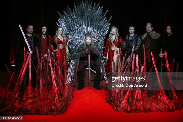 Models pose alongside a replica Iron Throne at the Australian Premiere of "House Of The Dragon" at Hoyts Entertainment Quarter on August 16, 2022 in...