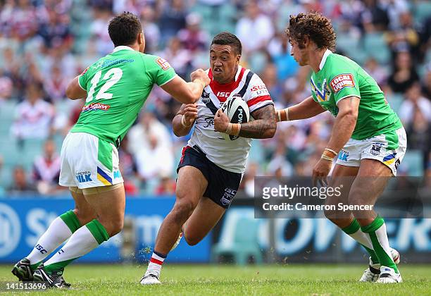 Lama Tasi of the Roosters runs the ball during the round three NRL match between the Sydney Roosters and the Canberra Raiders at Allianz Stadium on...
