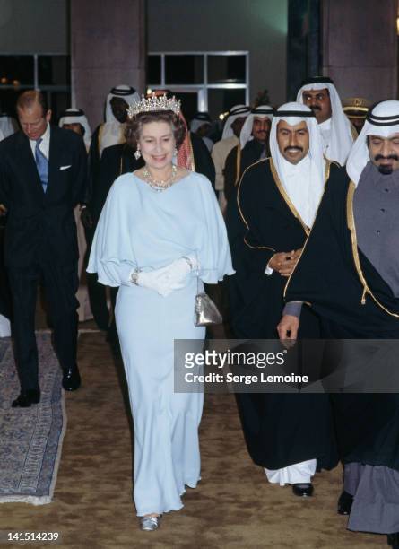 Queen Elizabeth II at a function during a state visit to Kuwait, February 1979. On the left is Prince Philip.