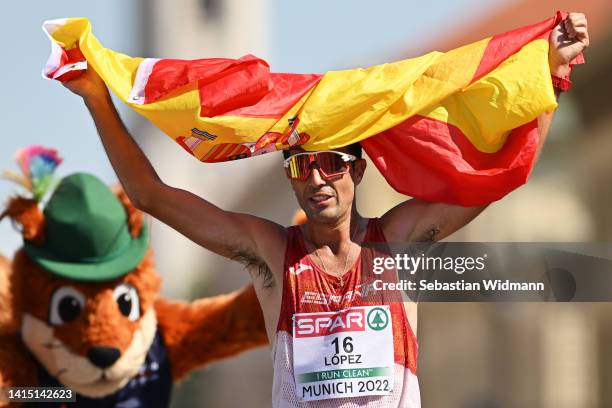 Miguel Angel Lopez of Spain celebrates as he crosses the finish line to win gold during the Athletics Men's 35km Race Walk competition on day 6 of...