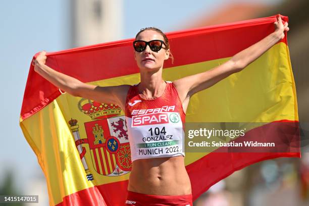 Raquel Gonzalez of Spain celebrates crossing the finish line to win silver during the Athletics Women's 35km Race Walk competition on day 6 of the...