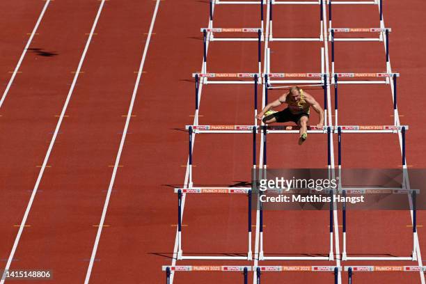 Arthur Abele of Germany competes in the Men's Decathlon 110m Hurdles Heat 4 alone after being disqualified from an earlier heat following a false...