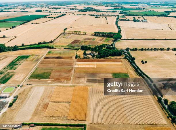 an aerial view of fields during a drought - droogte stockfoto's en -beelden