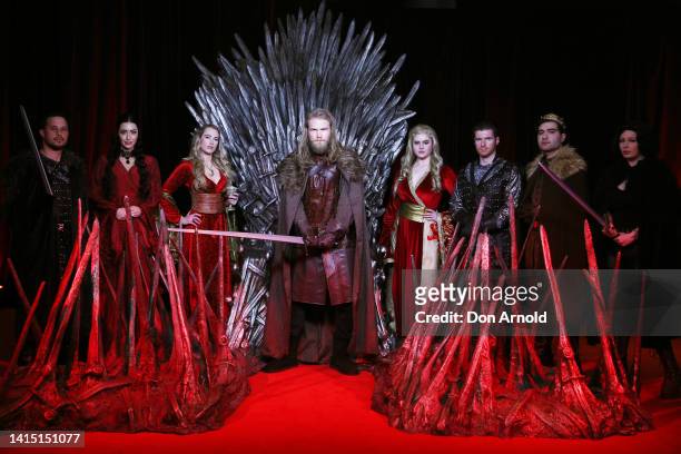 Models pose alongside a replica Iron Throne at the Australian Premiere of "House Of The Dragon" at Hoyts Entertainment Quarter on August 16, 2022 in...