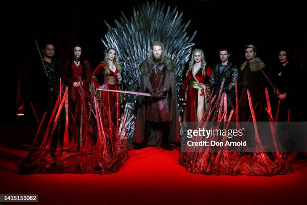 Models pose alongside a replica Iron Throne at the Australian Premiere of "House Of The Dragon" at Hoyts Entertainment Quarter on August 16, 2022 in...