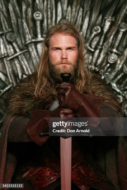 Models pose alongside a replica Iron Throne at the Australian Premiere of "House Of The Dragon" at Hoyts Entertainment Quarter on August 16, 2022 in...