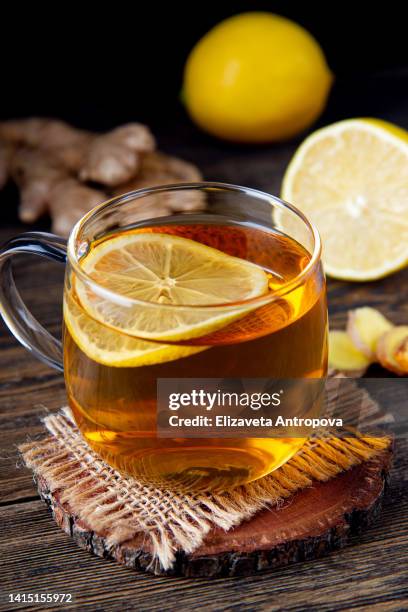 tea with lemon and ginger - ginger glasses stock-fotos und bilder