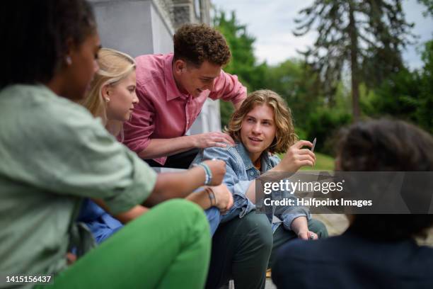 young teenager smoking marihuana cigarettes. - human joint stock-fotos und bilder