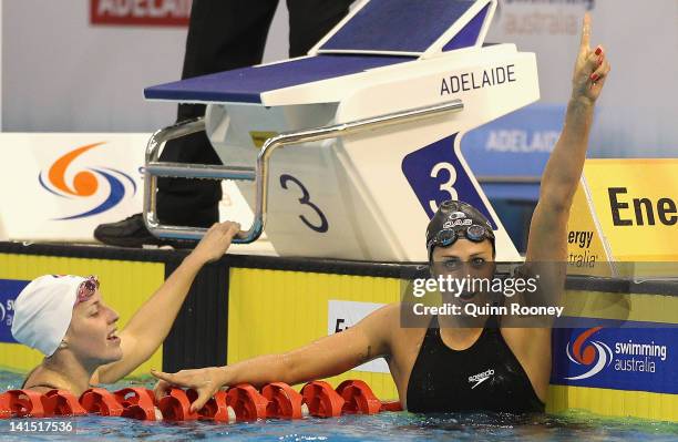 Stephanie Rice of Australia celebrates as Alicia Coutts catches her breath after the Final of the Women's 200 Metre Individual Medley during day four...