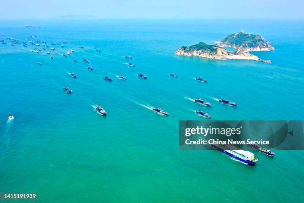 Aerial view of fishing boats setting sail for fishing after the three-and-a-half-month summer fishing ban was lifted on August 16, 2022 in Lianjiang...